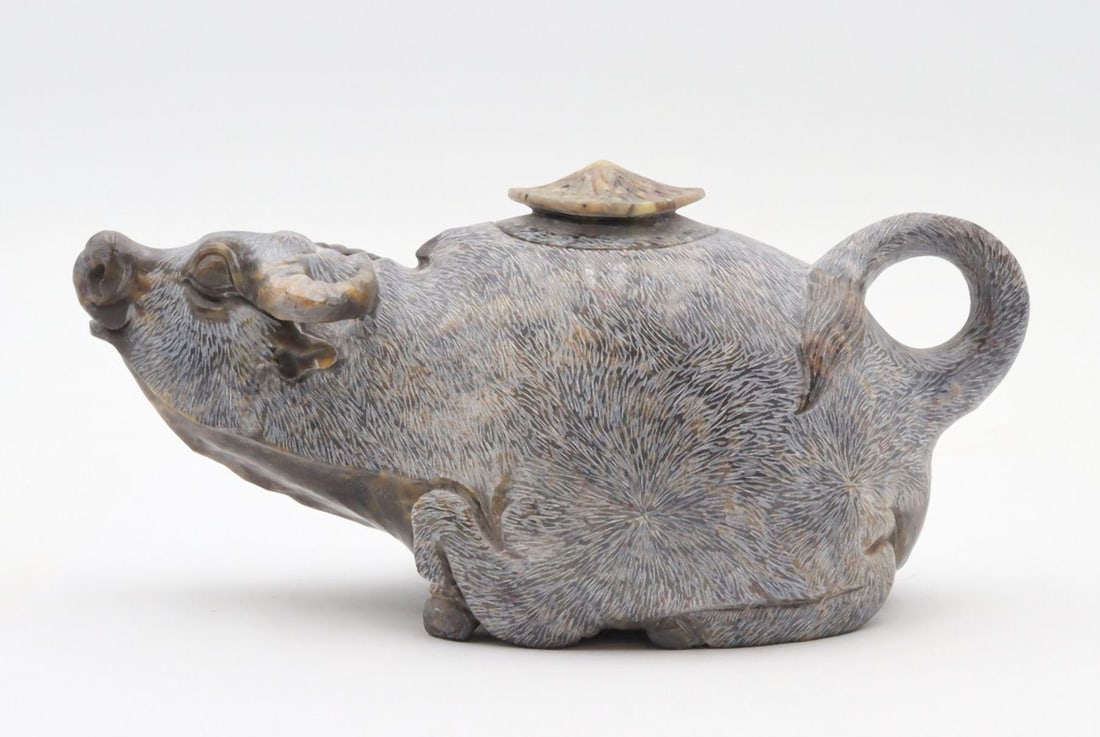 Chinese Hand Carved Jadeite Tea Pot: Chinese Hand Carved Jadeite Tea Pot. Depicting a bull. Measures approx. - 3" high x 7" wide. Have a similar item to sell? Contact us at info@marketauctionsinc.com Please review all photos