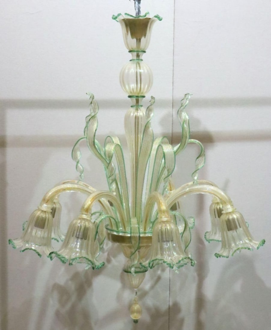 Vintage Italian Murano Art Glass 8-Light Chandelier: Vintage Italian Murano Art Glass 8-Light Chandelier. Beautiful gold flecks throughout, green outline. Measures approx. - 43 1/2" high x 36" diameter. Have a similar item to sell? Contact us at