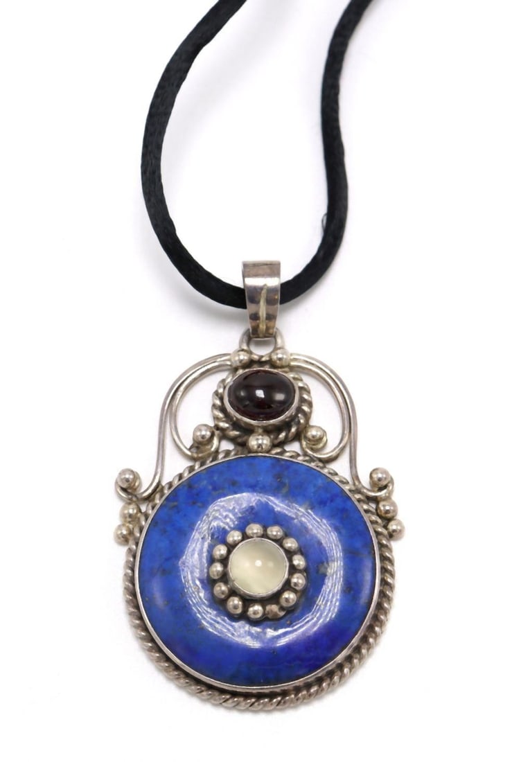 Native American Lapis, Garnet Sterling Silver Pendant: Native American Lapis, Garnet Sterling Silver Pendant with Black Silk Necklace. Measures approx. - 30" long (necklace). Weight approx. - 23.6 grams (pendant weight). Have a similar item to sell? C