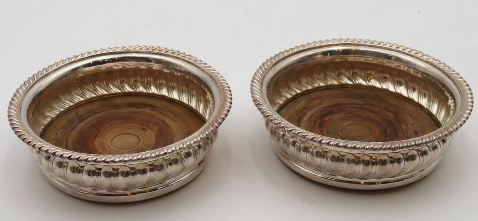 Pair of Antique Silver Plated Wine Coasters: Pair of Antique Silver Plated Wine Coasters. Measures approx. - 2" high x 6 1/4" diameter. Have a similar item to sell? Contact us at info@marketauctionsinc.com Please review all photos cl
