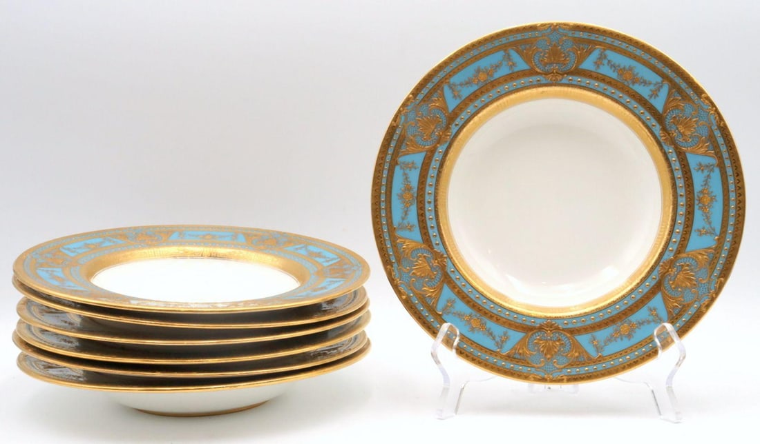 7 Pc. Mintons for Tiffany & Co. Gilded Rimmed Soup Bowls: 7 Pc. Antique Mintons for Tiffany & Co. Gilded Rimmed/Cream Soup Bowls. Measures approx. - 9" in diameter. The plates feature a turquoise background with 6 gilt cartouches composed of a central leaf i
