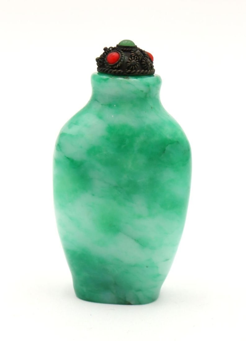 Chinese Jade Snuff Bottle: Chinese Jade Snuff Bottle. Measures approx. - 2 3/4" high x 1 1/2" wide. Please note - we don't believe the top is original the bottle. Have a similar item to sell? Contact us at info@