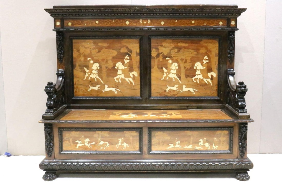 Antique Italian Renaissance Hallway Chest Bench: Antique Italian Renaissance Hallway Chest Bench with bone inlays depicting tradesmen on horseback with small animals running along side. Mythical creatures carved into the armrests. Bench opens nicely