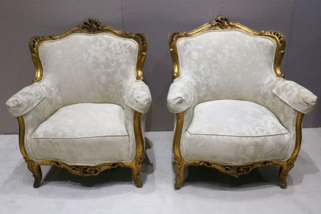 Antique French Bergere Ormolu Gilt Lounge Chairs: Antique French Bergere Lounge Chairs in wonderful condition. The only noticeable wear would be fading along the gilt, otherwise these have been cared for rather well. Padding is a cream colored off-wh
