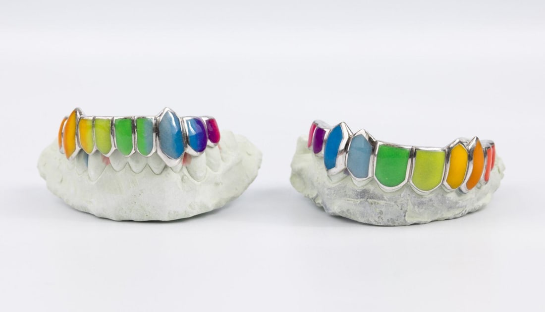 14Kt Gold & Multi-Colored Enamel Grills: Pair of 14Kt Gold & Multi-Colored Enamel Grills. Believed to be plaster or alginate teeth. molds, top and bottom for casting of grills. Bottom and top have the number 65443 marked on bottom of each. S