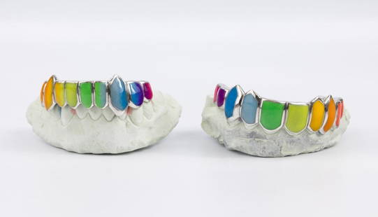 14Kt Gold & Multi-Colored Enamel Grills: Pair of 14Kt Gold & Multi-Colored Enamel Grills. Believed to be plaster or alginate teeth. molds, top and bottom for casting of grills. Bottom and top have the number 65443 marked on bottom of each.