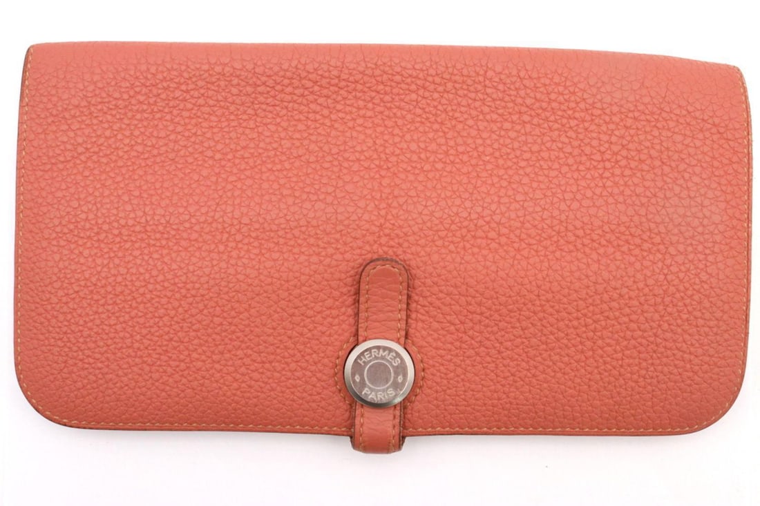 Hermes Dogon Togo Leather Clutch Wallet: Hermes France Dogon Recto-Verso Rosy-Togo Leather Clutch Wallet, with Fold-in Flap Closure. Leather lining with 8 card slots and 3 cash pockets. Measures approx.- 8" x 4 1/4". Condition is ove