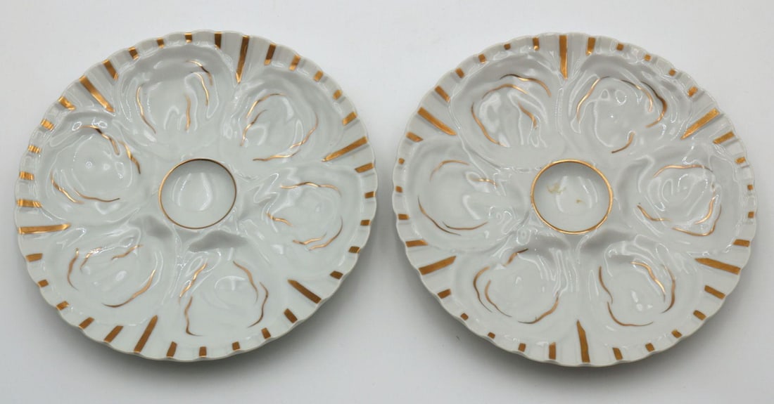 Pair of Porcelain 6 Well Porcelain Oyster Plates: Pair of Porcelain 6 Well Porcelain Oyster Plates. Measures approx. - 9 1/4" diameter. Have a similar item to sell? Contact us at info@marketauctionsinc.com Please review all photos closely. Th