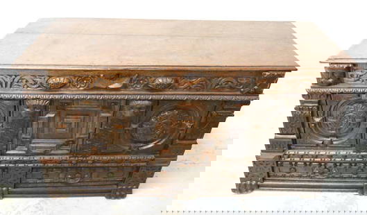Antique English Carved Wooden Coffer: Antique English Carved Wooden Coffer. Carved wooden faces, symbols, and has small cabinets on the front and small cabinets inside the coffer door, good condition. Measurement Approx.- 60" L X 25&#