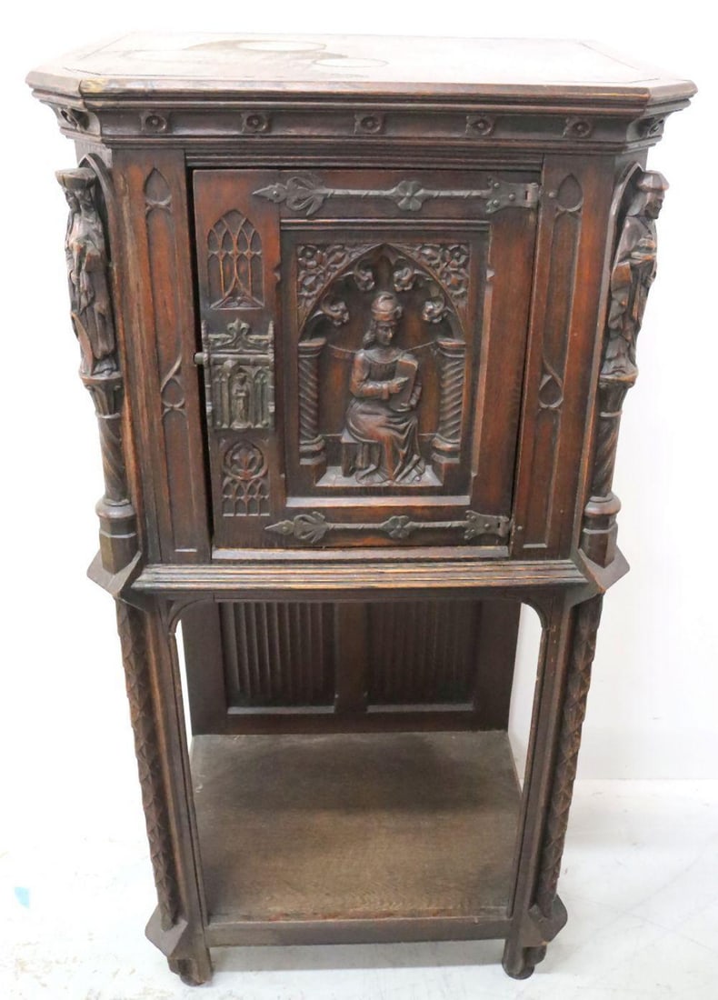 Vintage Venetian Style Carved Wooden Standing Cabinet: Vintage Italian/Venetian Style Carved Wooden Standing Cabinet with hand carvings of a man holding a block and two women in the corners of it, linen fold panels underneath it, says made in Belgium in t