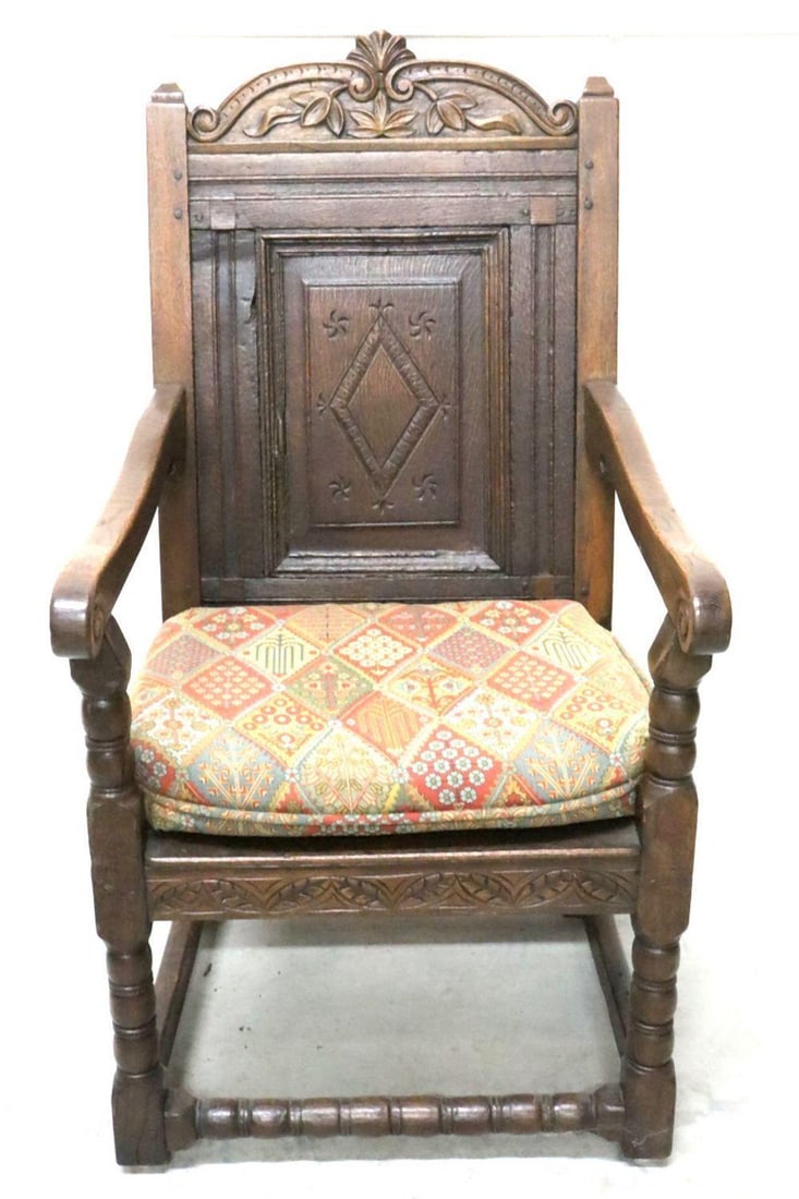 Antique English White Oak Cushioned Chair: Antique English White Oak Cushioned Chair. engravings of tobacco leaves on it, some deterioration of the wood on the back. Measurement Approx.- 47 1/4"H X 23 1/2"L X 28 1/2" W Have a simil