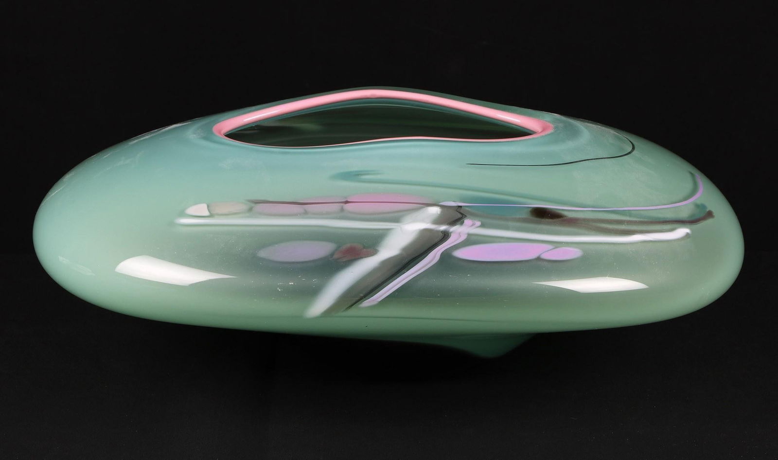 Rick Nicholson Art Glass Bowl: Green and pink art glass bowl by Rick Nicholson. It measures approx 5.25" t x 15" x 10.5". The signature is hard to make out but we believe it to read Nicholson and dated '89. In great