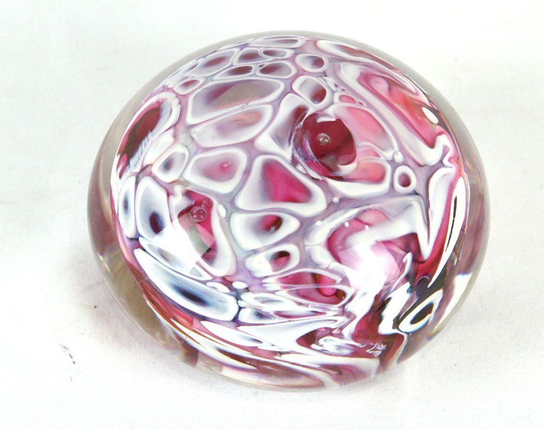 Marbled Glass Paperweight: Marbled Glass Paperweight in a fluid pink and purple design. Measures approx. 4 1/2" dia. Have a similar item to sell? Contact us at info@marketauctionsinc.com Please review all photos closely
