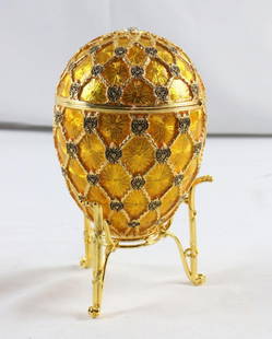Imperial Coronation Faberge` Egg Replica: Imperial Coronation Faberge&#96; Egg Replica with Carriage. Measures approx. 5 1/2&#34; H x 3 1/4&#34; dia. With stand measures approx. 7&#34;H x 4&#34;D x 4&#34; W. Condition is overall good. Have a