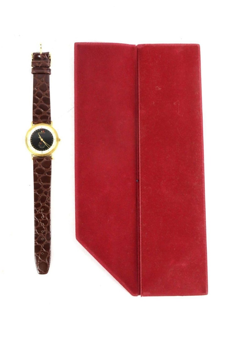 Movado Esq. Goldplated Day/Date Watch: Movado Esq. Goldplated Day/Date Watch with original pouch. Includes original strap. Condition is overall good. ? Have a similar item to sell? Contact us at info@marketauctionsinc.com Please review