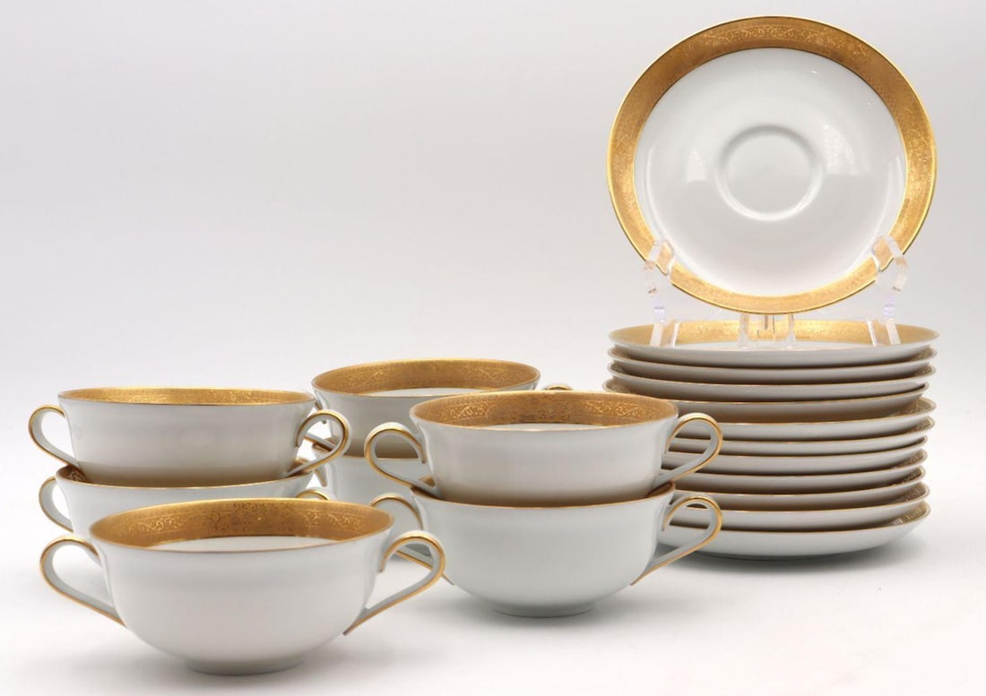 Vintage "Pomeroy" Lorenz Hutschenreuther Porcelain Teacup Set: Vintage "Pomeroy" Lorenz Hutschenreuther Porcelain Double-Handled Teacup Set. Includes 12 gilt lined saucers and 7 gilt-edged tea cups. Saucers measure approx.- 6 1/4" in diameter, and tea