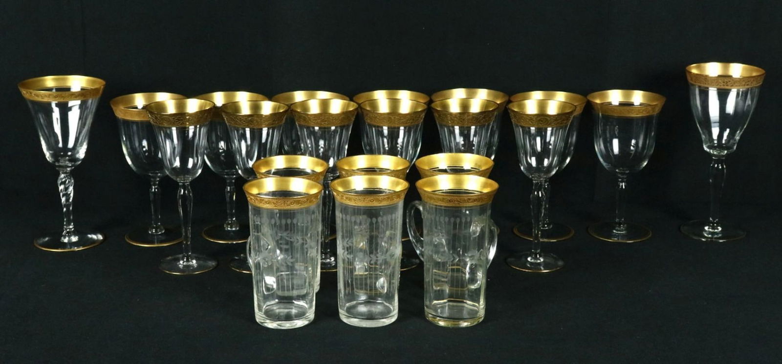21 Pc. Vintage Gold Rim Glassware: 21 Pc. Vintage Gold Rim Glassware. In the style of St. Louis Thistle. Set contains 6 mugs, 6 wine glasses, 7 water goblets, 1 large cup and 1 medium size cup. Have a similar item to sell? Contact us a