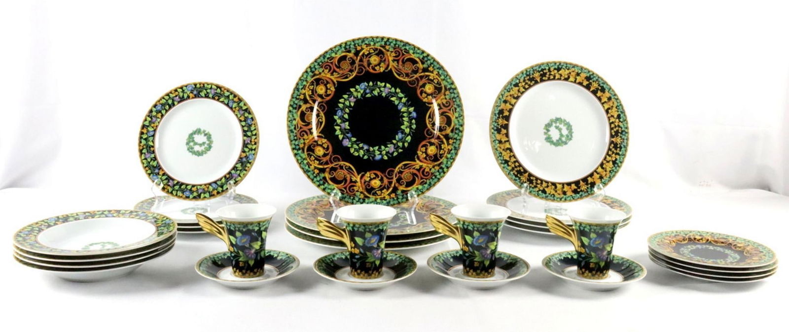 28 Pc. Rosenthal Versace "Gold Ivy" Porcelain Dinner Set: 28 Pc. Rosenthal Versace "Gold Ivy" Porcelain Dinnerware China Set. Discontinued - 2004. This set contains 4 chargers - 12" 4 dinner plates - 10 1/2" 4 salad plates - 8 3/4" 4 rim