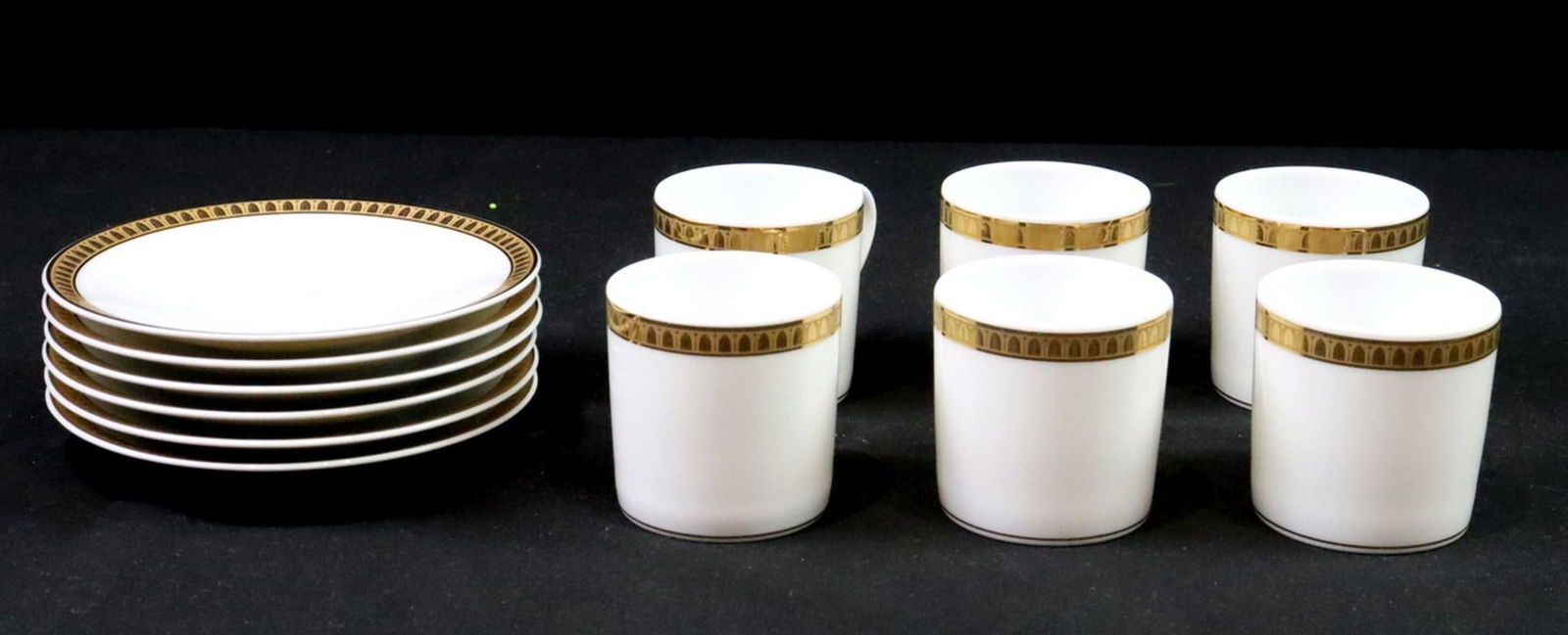 6 Pc. Christofle "Malmaison" Porcelain Demitasse Cup & Saucer Set: 6 Pc. Christofle "Malmaison" Porcelain Demitasse Cup & Saucer Set. Each saucer measures approx. - 5" dia. Each cup measures approx. - 2 1/4" H x 3" W x 2 1/4" D. Marked 