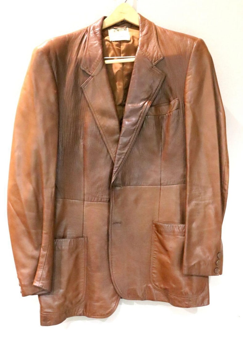 Vintage Gucci Collared Leather Blazer: Vintage Gucci Collared Leather Blazer. Tagged "G. Gucci Made in Italy Genuine Leather", marked size 52. Measures approx. - 32" in length and 18" shoulder to shoulder. Arms measure appr
