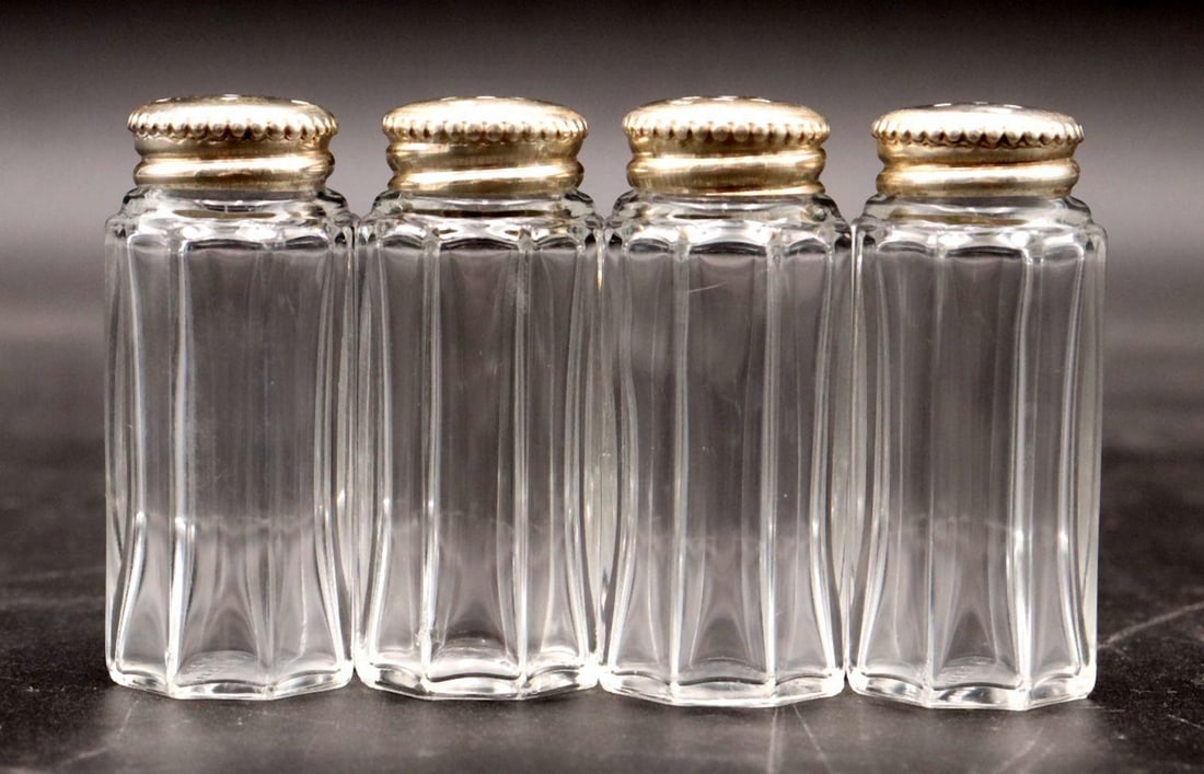 4 Pc. Christofle Sterling & Crystal Salt & Pepper Shakers: 4 Pc. Christofle Sterling & Crystal Salt & Pepper Shakers. Each measure approx. - 2 1/4" H x 1" Diameter. Stamped "Christofle France" underside. Condition is overall good. Have a similar item to sell?