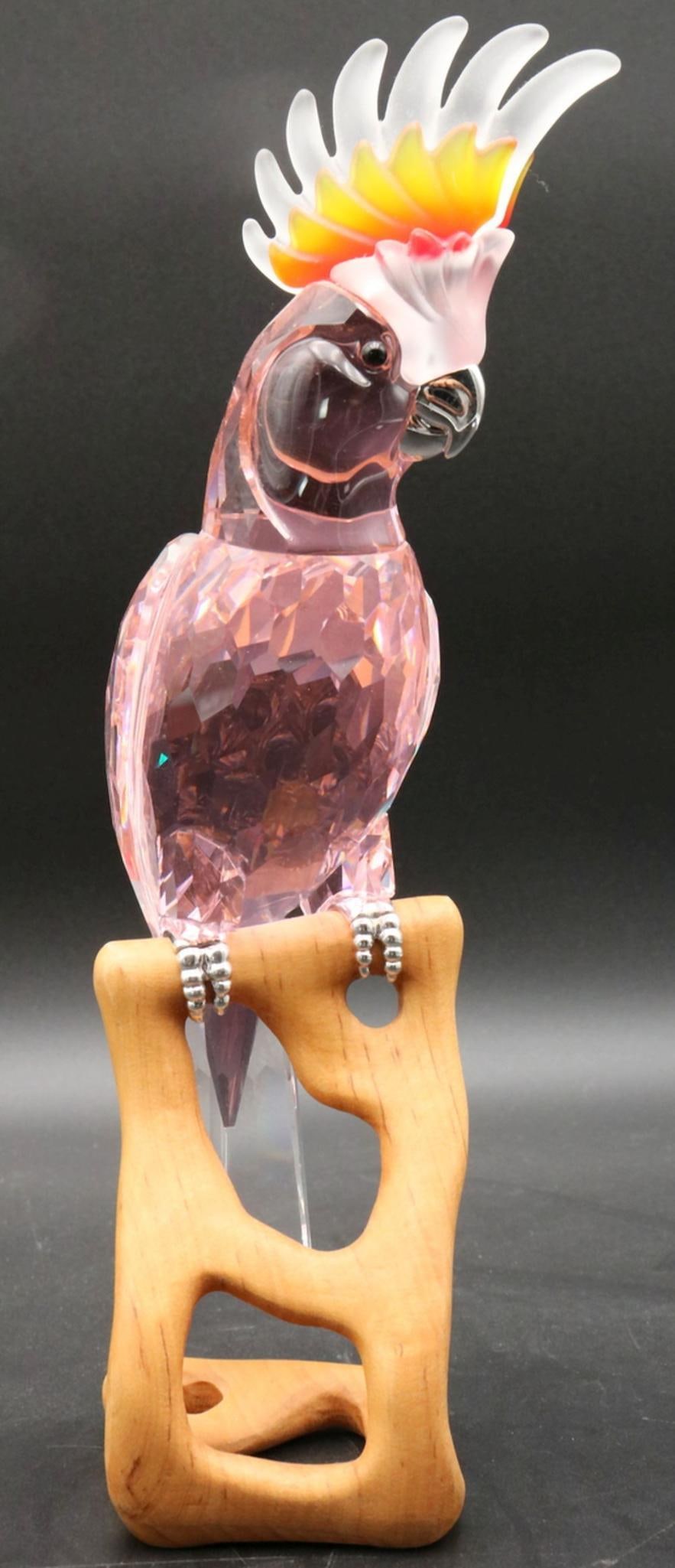 Swarovski "Cockatoo" Crystal Sculpture: Swarovski Crystal "Cockatoo" figurine from the Paradise Bird Collection, model number #507237. This multifaceted Swarovski red crystal Cockatoo bird has a pastel pinkish coloration. The figuri