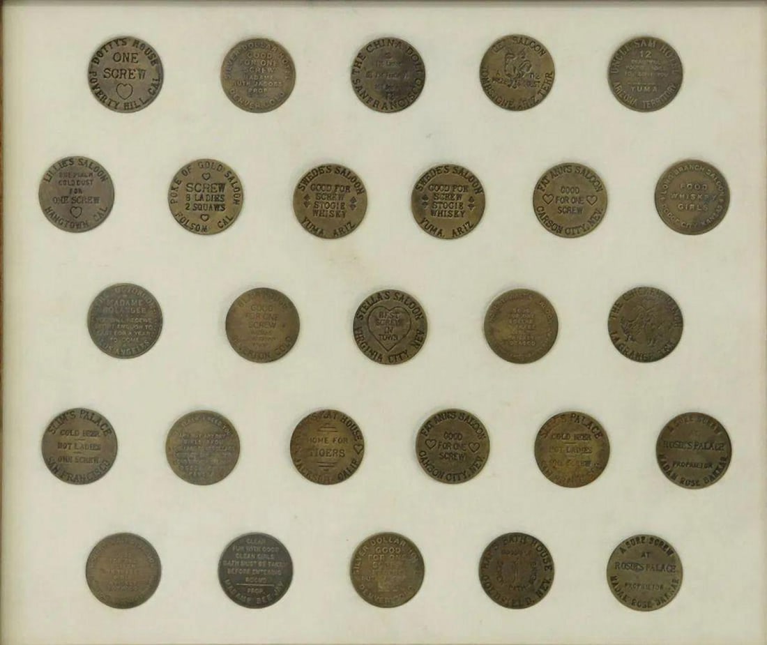Collection of Twenty-Seven American Brothel Coins: Collection of Twenty-Seven American brothel coins from California, Colorado, Arizona, Kansas, Nevada and Texas. Each token is "Good For One Screw" and measures approximately 1 1/2". Frame