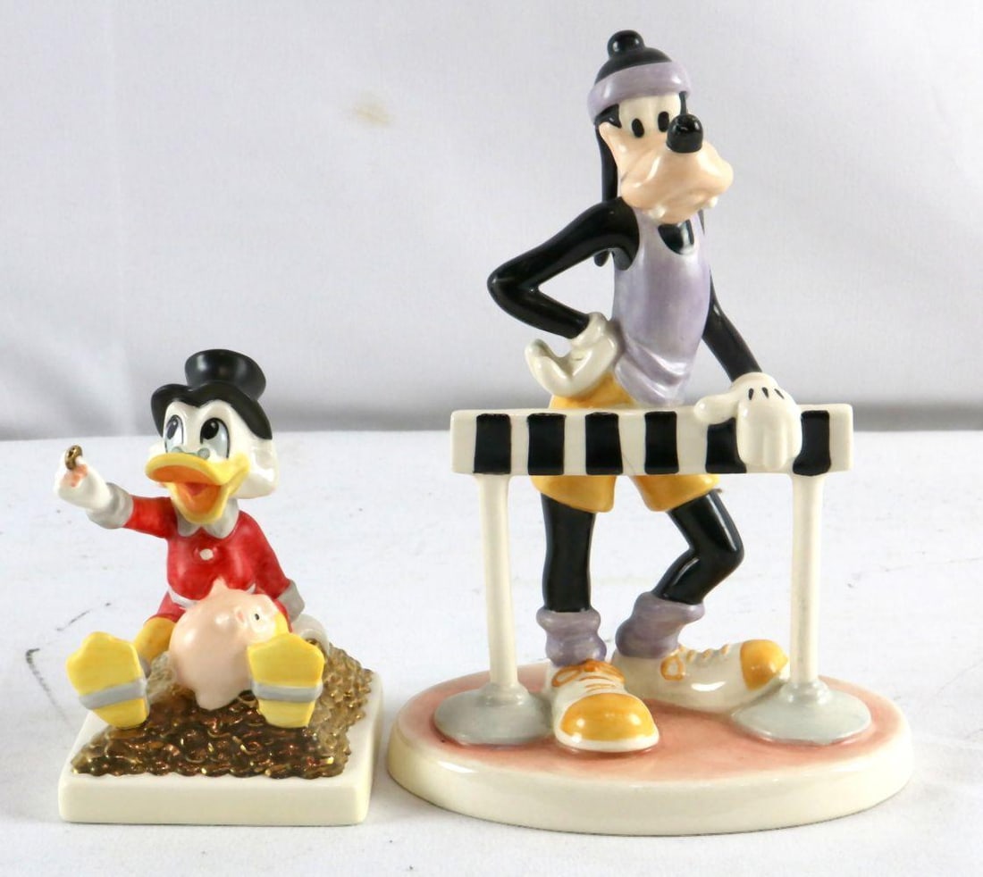 Pair of Porcelain Goebel Disney Figurines: Pair of Goebel Porcelain Disney Figurines: Sport Goofy and Scrooge McDuck A finely modeled pair of porcelain figurines by Goebel, depicting two of Disney’s most enduring characters. Sport Goofy