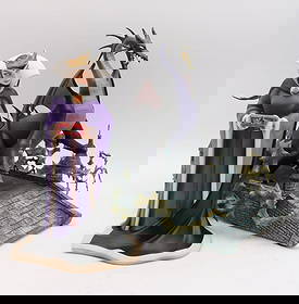 Pair of Walt Disney "Maleficent" Ceramic Figurines: Pair of Walt Disney Classics Collection “Maleficent” Ceramic Figurines Figurines ranging from approx. 7 ½ x 11 ½ x 7 ½ in. to 13 x 15 ½ x 14 in. Comprising two dramatic