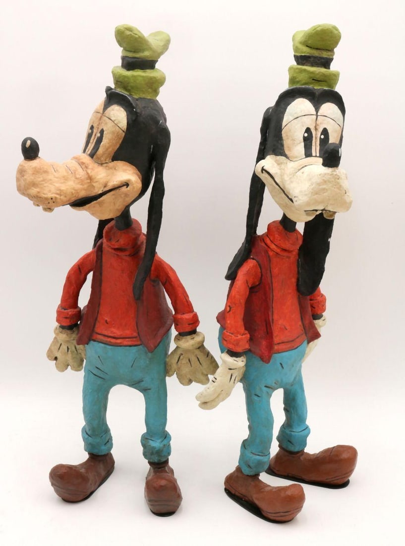 Two Disney Wood-Carved Poliwogg Goofy Sculptures: Lot of Two Poliwogg “Vintage Years Goofy” Hand-Carved Wood Sculptures Disney, late 20th century A pair of finely carved and hand-painted wooden sculptures depicting Goofy from the Vintage