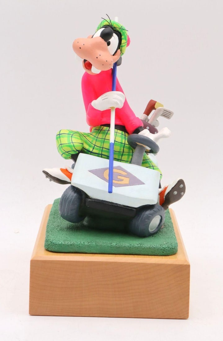 Disney Hand-Painted Wood Carved "Goofy Golfing" Figurine: Disney Hand-Painted Wood-Carved “Goofy Golfing” Figurine Maker: Disney Date: 1992 Dimensions: Approximately 9 in. H × 6 in. W × 4½