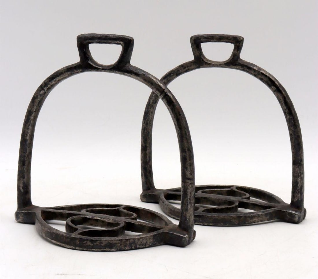 Pair of Antique French Forged-Iron Stirrups: A Pair of French Forged-Iron Stirrups 18th Century Height: 6 in. (15.2 cm); Width: 6 in. (15.2 cm) Of elegant simplicity and robust construction, this pair of French