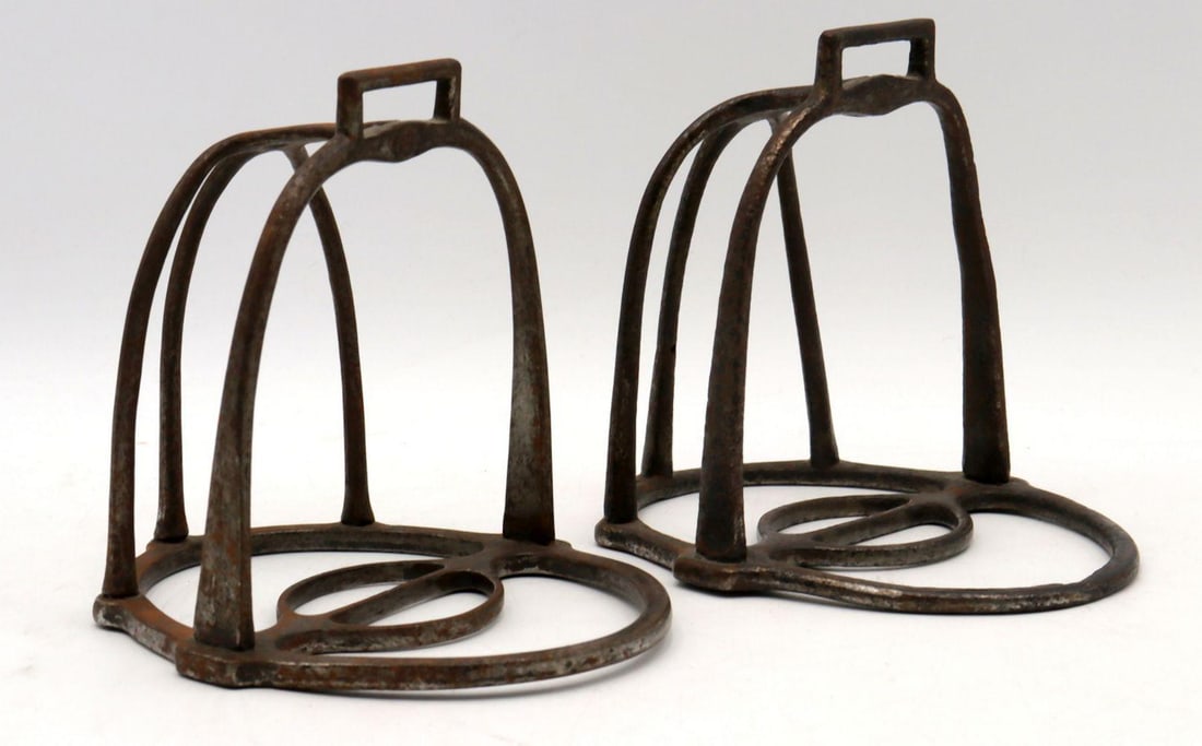Pair of Antique French Forged-Iron Stirrups: A Pair of French Forged-Iron Stirrups (Étriers à Grille) Late 17th to Early 18th Century Height: 5¾ in. (14.6 cm); Width: 5? in. (13 cm) This finely forged pair of Fr