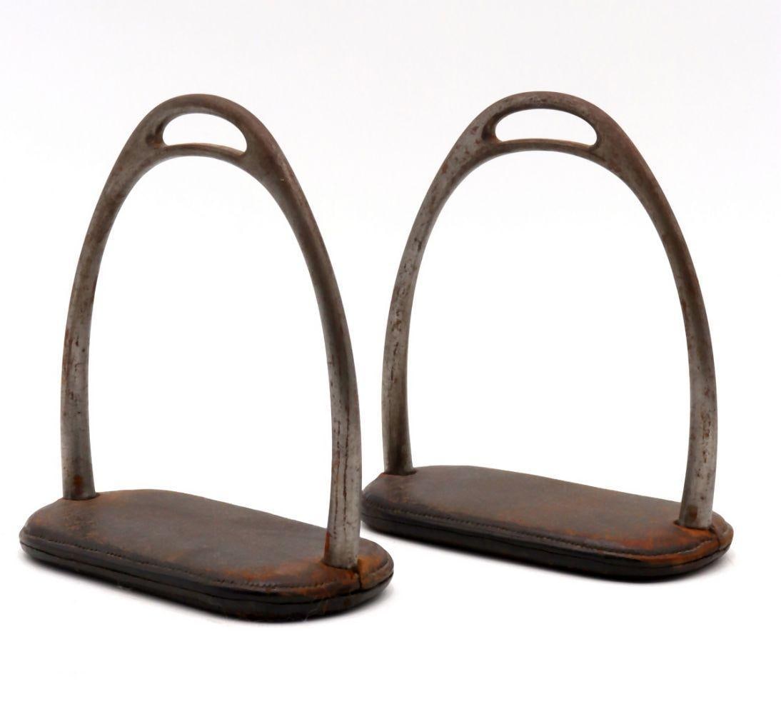 Antique English Iron and Leather Stirrups: An English Iron and Leather Stirrups Early 19th Century Height: 6 in. (15.2 cm); Width: 5¼ in. (13.3 cm) Of restrained elegance and functional design, this English st