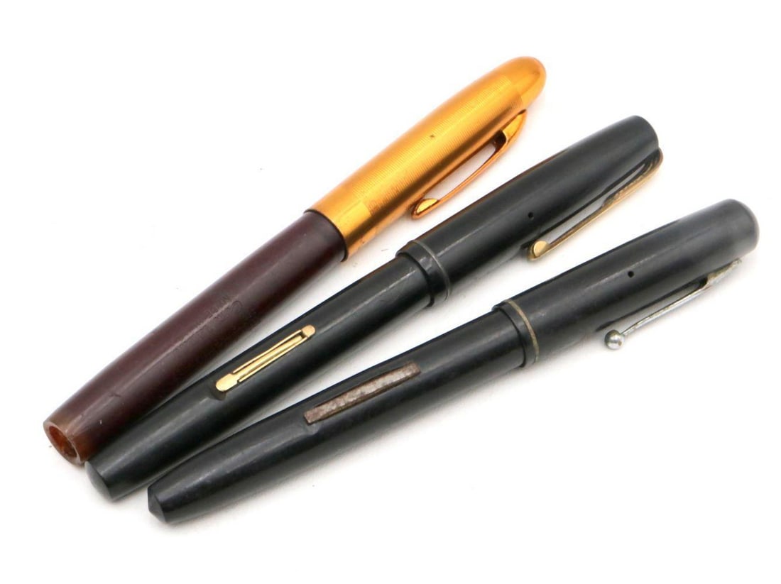 Lot of 14k Nib Fountain Pens: LOT OF THREE 14K GOLD NIB FOUNTAIN PENS American and European, mid-20th century Black and resin with 14k gold nibs Each approximately 5 in. (12.7 cm) long Unmarked (nibs stamped 14K)
