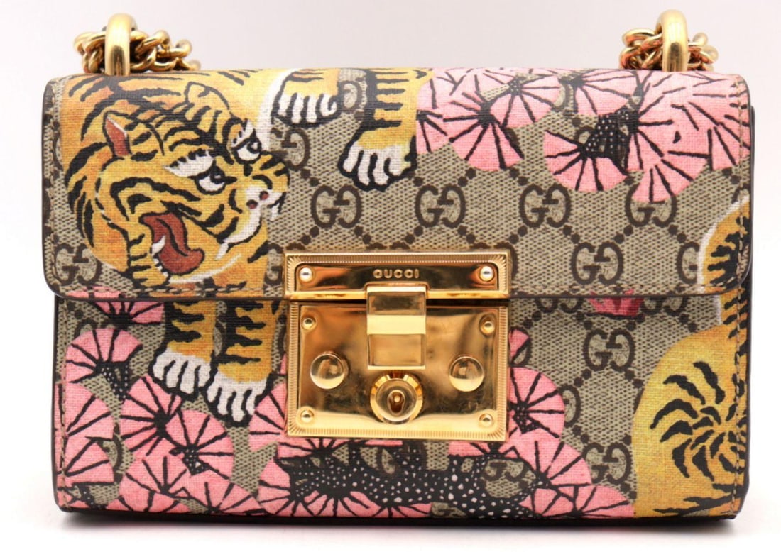 Gucci GG Supreme Brown Tiger Bengal Print Shoulder Bag: GG Supreme Brown Tiger Bengal Print Shoulder Bag Rendered in Gucci’s iconic GG Supreme coated canvas, this spirited shoulder bag showcases the celebrated Tiger Bengal print, depicting prowling t