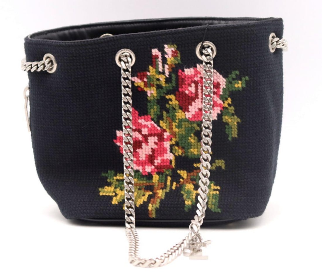 Yves Saint Laurent Baby Embroidered Wool Emmanuel Bucket Bag: YVES SAINT LAURENT Baby Embroidered Wool Emmanuel Bucket Bag A distinctive and textural reinterpretation of a classic bucket silhouette, this Baby Emmanuel bag is crafted in richly embroidere