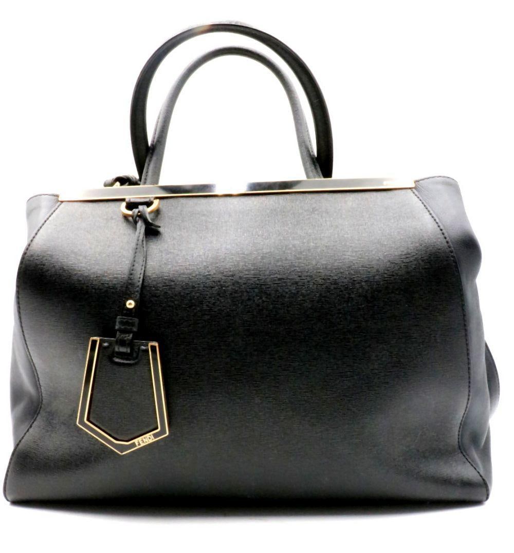 Fendi "2Jours" Black Saffiano Leather Hand Bag: Fendi, Italian. “2Jours” Black Saffiano Leather Handbag. Crafted in textured Saffiano leather, this black 2Jours handbag features the structured silhouette that has become emblematic of th