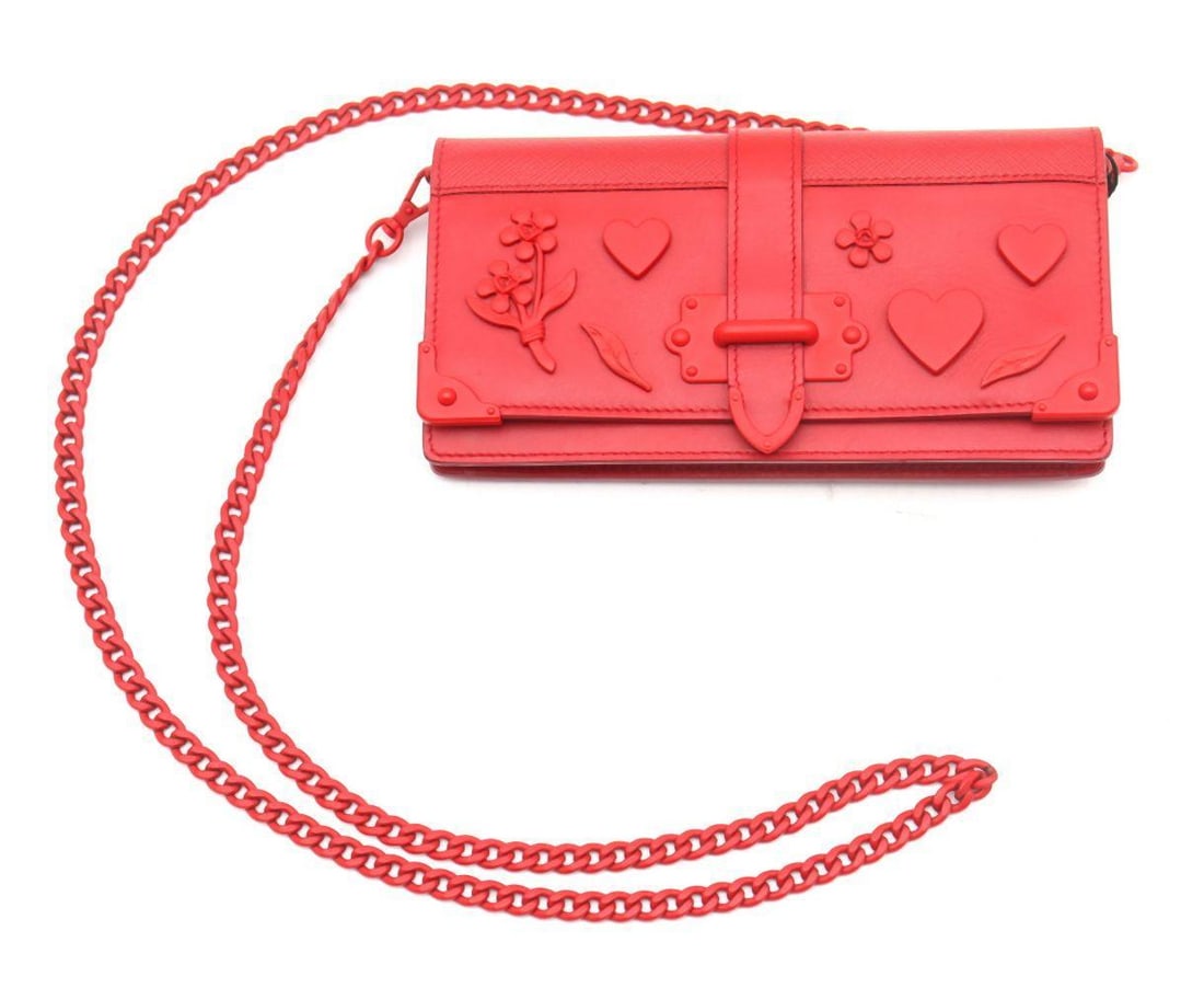 Prada City Saffiano L Cahier Mini Crimson Hearts Shoulder Bag: City Saffiano L Cahier Mini Crimson Hearts Shoulder Bag Crafted in signature Saffiano leather, this charming Cahier Mini shoulder bag features a vibrant crimson ground punctuated by whimsical heart mo