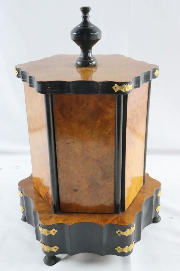 19th C. French Walnut Gilt Rotating Jewelry Display: A FRENCH BURL WALNUT, EBONIZED, AND GILT-METAL ROTATING JEWELRY CASKET Mid-19th Century Height: 15 in. (38 cm) Width: 9 ½ in. (24 cm) Depth: