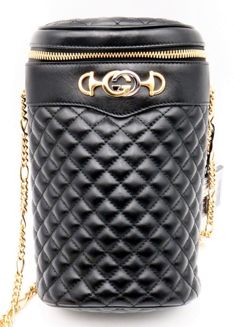 Gucci Leather Quilted Cylinder Crossbody Chain Bag: GUCCI, A LEATHER QUILTED CYLINDER CROSSBODY CHAIN BAG Rendered in supple quilted leather, this distinctive cylinder-shaped crossbody bag highlights Gucci’s contemporary experimentation with for