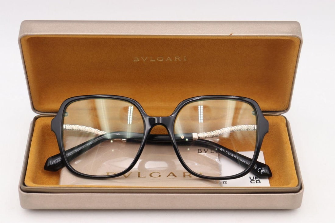 Bvlgari Black Rimmed Eyeglasses with Case: BVLGARI BLACK-RIMMED EYEGLASSES OBV4201BF WITH CASE, ITALY A refined and contemporary eyewear design by Bvlgari, these black-rimmed OBV4201BF eyeglasses feature a sleek, modern silhouette crafted with