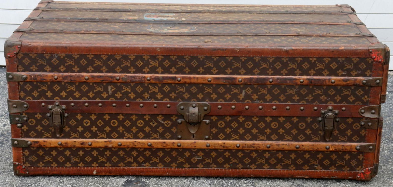Antique Louis Vuitton Monogram Canvas Wardrobe Trunk: Louis Vuitton (French) Monogram Canvas Wardrobe Trunk Circa late 1920s–early 1930s 17 1/4 in. high x 44 1/2 in. long x 23 1/4 in. deep A French Louis Vuitton wardrobe trunk covered in classic