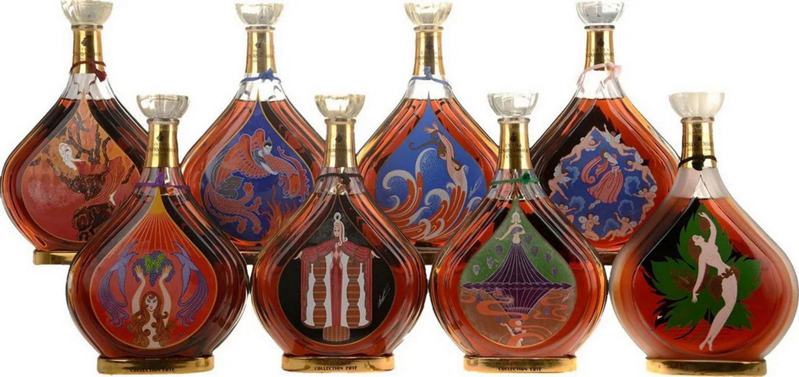 Rare Set of 8 Erte Courvoisier Cognac Bottle Collection: Erte (Romain de Tirtoff) (Russian, 1892–1990) The Complete Set of Eight Courvoisier Cognac Bottles Each bottle: 10 inches high x 6 1/2 inches wide Each box: 11 3/8 inches high x 8 1/4 inches wid
