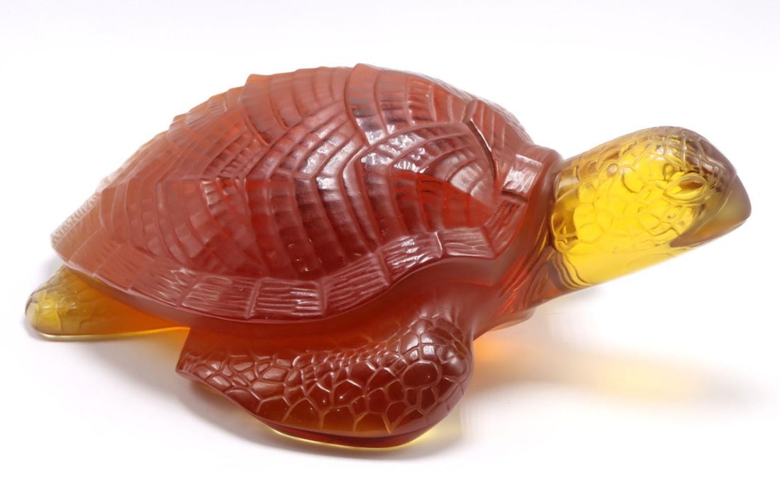 Lalique "Caretta" Amber Crystal Turtle Sculpture: Lalique (French) Caretta Late 20th century Measurements: approximately 11 in. L x 4 in. H x 7 1/2 in. W Amber crystal Crystal sculpture depicting a sea turtle modeled in a naturalistic, resting pose