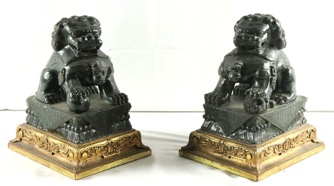 Pair of Chinese Carved Jade Foo Dog Sculptures: Chinese Pair of Foo Dog (Guardian Lion) Sculptures Late Qing dynasty (circa 1880–1920) Measurements: approximately 13 in. H x 10 1/2 in. L x 8 in. W (each) Nephrite jade, gilt wood bases Pair