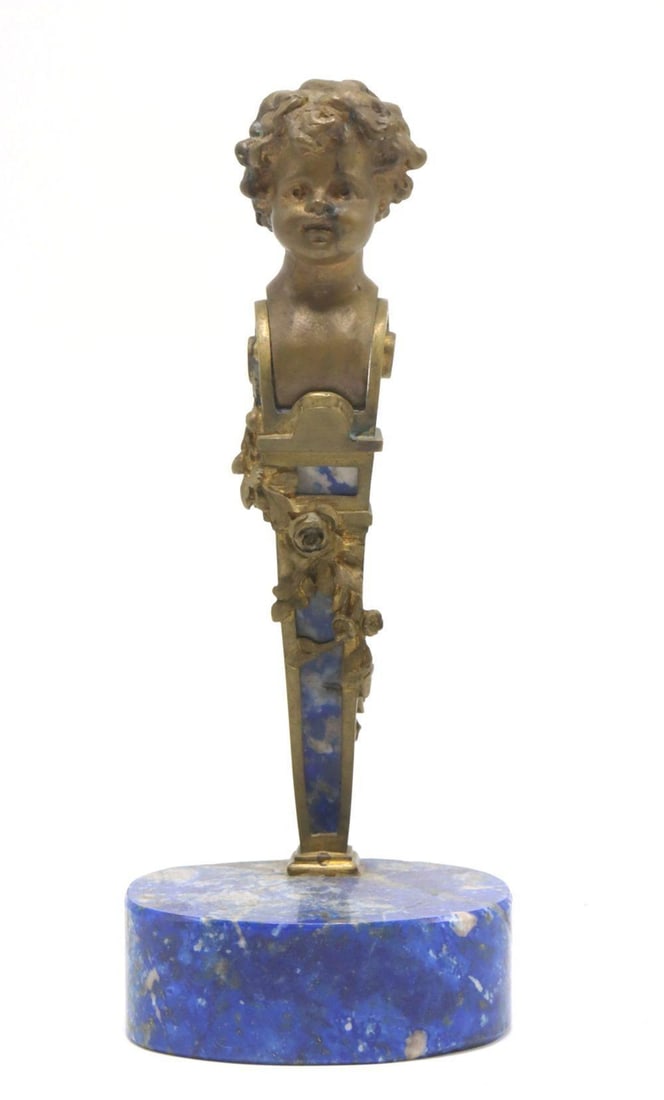 Late 19th C. Bronze & Lapis Lazuli Cherub Figurine: Continental European Bronze and Lapis Lazuli Figurine Late 19th–early 20th century Measurements: 5 1/2 in. H × 2 1/4 in. W × 1 5/8 in. D Gilt bronze and hardstone. A Continental