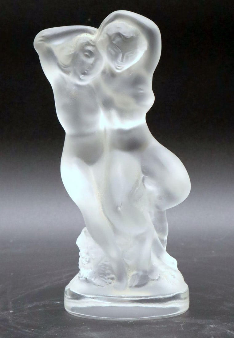 Lalique "Le Faune" Crystal Sculpture: Lalique (French) Le Faune Crystal sculpture Measures 5 1/2 in. high x 3 1/4 in. wide Clear and satin-finished crystal figural sculpture depicting a standing faun with raised arms, the stylized nude