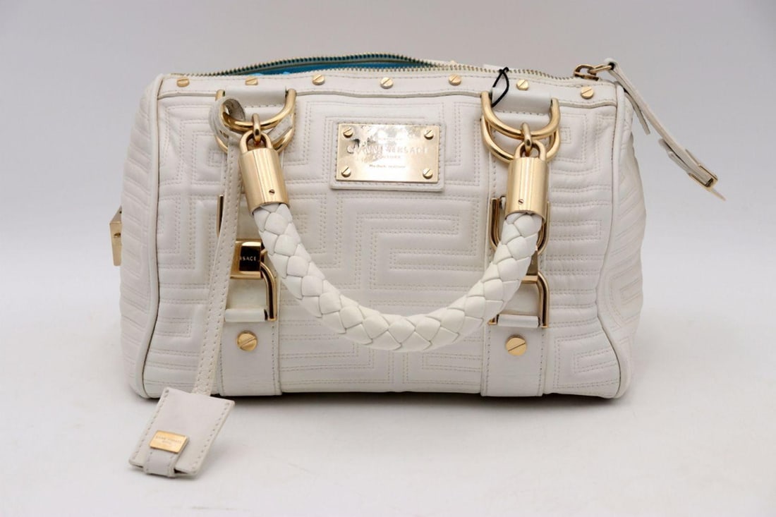 Gianni Versace White Quilted "Snap Out of It" Handbag: GIANNI VERSACE White Quilted “Snap Out of It” Handbag A bold and contemporary design from the house of Gianni Versace, this “Snap Out of It” handbag is executed in cri