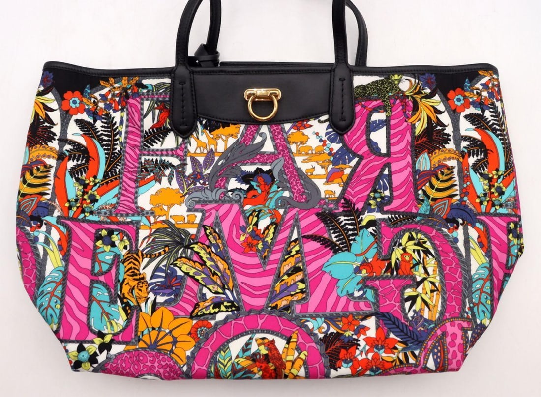 Ferragamo Gancini Graphic Print Multicolor Tote Bag: SALVATORE FERRAGAMO Gancini Graphic Print Multicolor Tote Bag Vibrant and contemporary, this multicolor tote features Ferragamo’s iconic Gancini motif reimagined as a bold graphic print